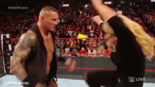 Two Men Are Fighting In A Wrestling Ring With The Word Live On The Bottom Right GIF