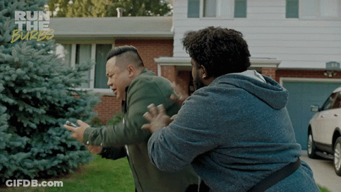 Two Men Are Fighting In Front Of A House With The Words Run The Burbs On The Bottom GIF