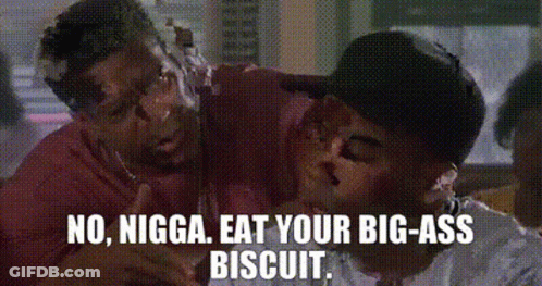 Two Men Are Fighting Over A Biscuit And One Of Them Is Covered In Icing . GIF