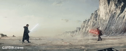 Two Men Are Fighting With Lightsabers In A Snowy Field GIF