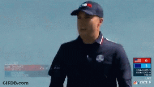 Two Men Are Giving Each Other A High Five During A Match GIF