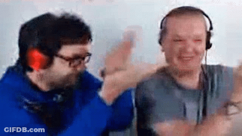 Two Men Are Giving Each Other A High Five While Wearing Headphones And Glasses . GIF