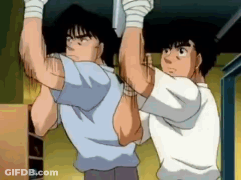 Two Men Are Hanging Upside Down From A Ceiling In A Room . GIF