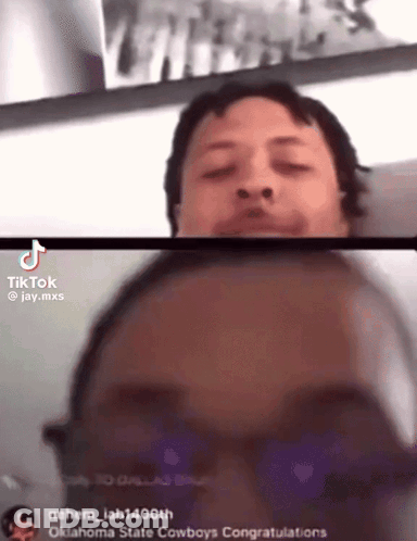 Two Men Are Having A Video Call And One Of Them Is Wearing Glasses GIF