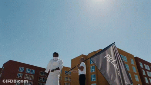 Two Men Are Holding A Flag That Says Pg Bank GIF