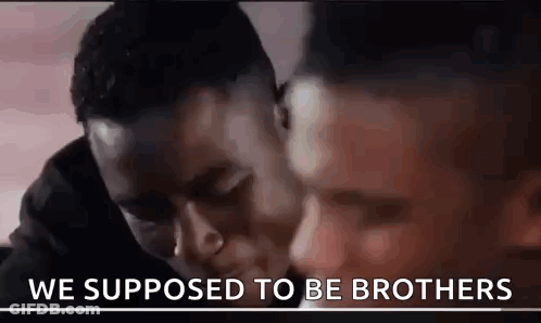 Two Men Are Hugging Each Other And The Words `` We Supposed To Be Brothers '' Are Written On The Bottom Of The Image . GIF