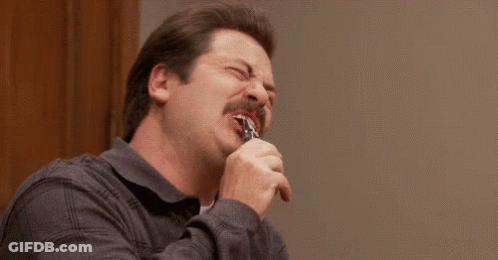 Two Men Are Laughing And Holding A Cell Phone . GIF
