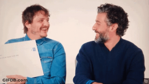 Two Men Are Laughing And One Is Holding A Piece Of Paper That Says ' I Love You ' GIF