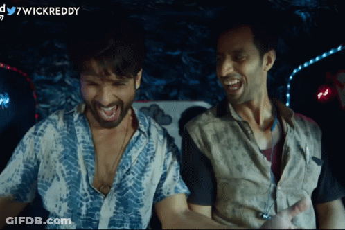 Two Men Are Laughing In A Dark Room And The Words Wickreddy Are On The Bottom GIF