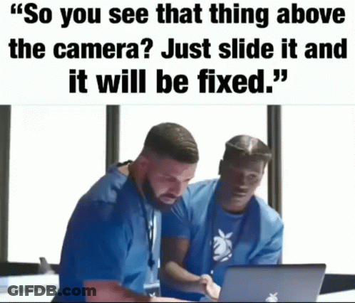 Two Men Are Looking At A Laptop And One Of Them Says " So You See That Thing Above The Camera Just Slide It And It Will GIF