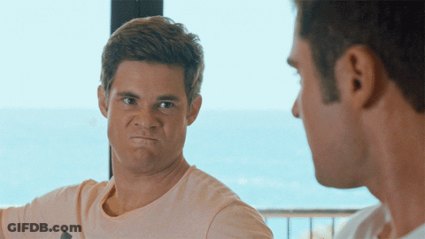 Two Men Are Looking At Each Other And One Is Making A Face GIF