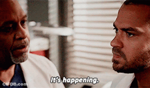 Two Men Are Looking At Each Other And One Of Them Says It 'S Happening GIF
