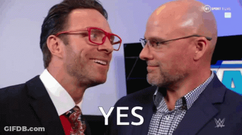Two Men Are Looking At Each Other And The Word Yes Is On The Screen GIF