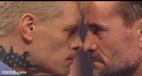 Two Men Are Looking At Each Other With Their Eyes Closed . GIF