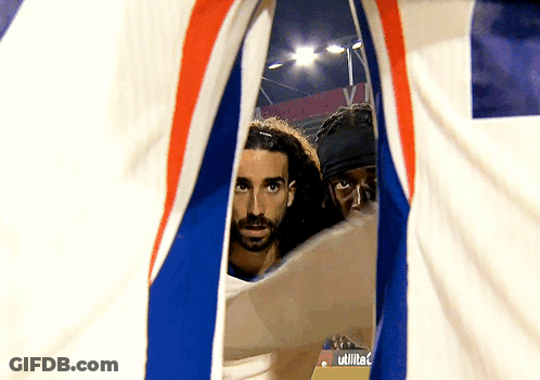 Two Men Are Looking Through A Hole In A Flag That Says Utilita GIF