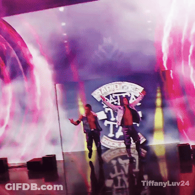 Two Men Are On A Stage In Front Of A Large Screen That Says Rapid Fire GIF