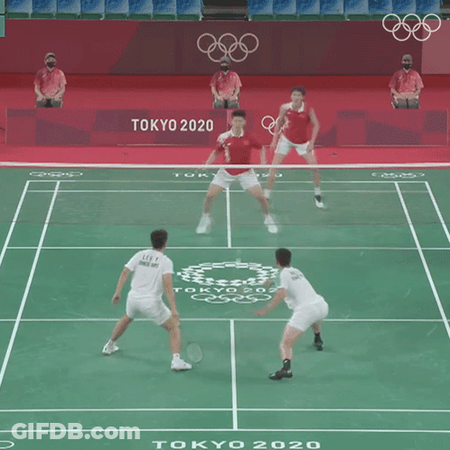 Two Men Are Playing A Game Of Badminton In Tokyo 2020 GIF