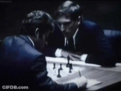 Two Men Are Playing A Game Of Chess In A Black And White Photo With A Caption That Says " Misconnected " GIF