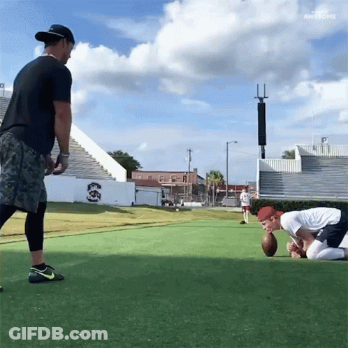 Two Men Are Playing A Game Of Football And One Of Them Is Wearing A Nike Shoe GIF
