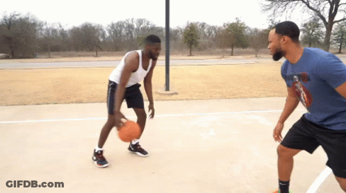 Two Men Are Playing Basketball On A Court And One Of Them Is Wearing A Shirt That Says Nike On It GIF