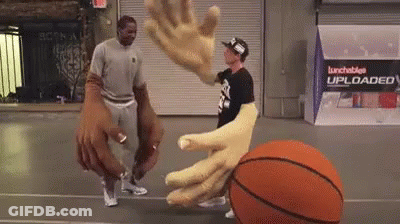 Two Men Are Playing Basketball On A Court With A Sign That Says Lunchables Uploaded On It GIF