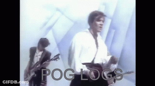 Two Men Are Playing Guitars In Front Of A White Wall With The Words Pog Logs Written On The Bottom . GIF