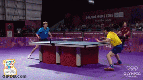 Two Men Are Playing Ping Pong At The Buenos Aires 2018 Olympic Channel Event GIF