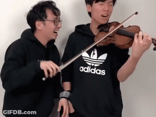 Two Men Are Playing Violins And One Has An Adidas Shirt On GIF