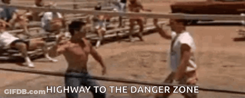 Two Men Are Playing Volleyball On A Beach And One Of Them Is Talking To The Other . GIF
