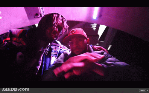 Two Men Are Posing For A Picture With One Wearing A Jacket That Says ' Supreme ' On The Back GIF