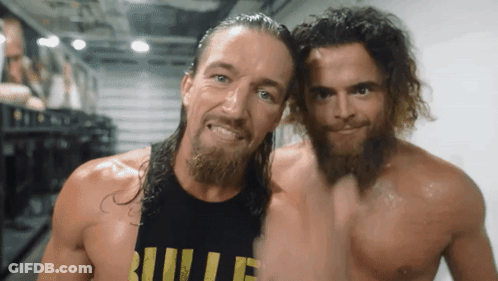 Two Men Are Posing For A Picture With One Wearing A Shirt That Says Bullet GIF