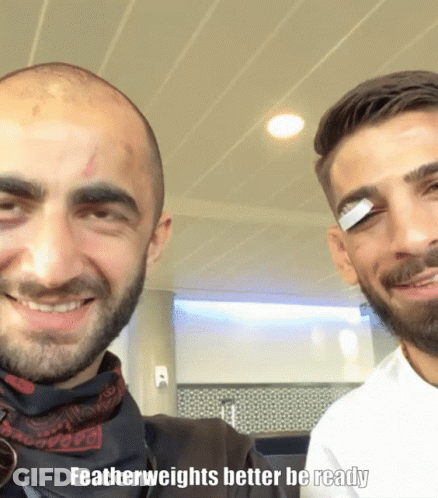 Two Men Are Posing For A Picture With The Caption " Featherweights Better Be Ready " On The Bottom GIF