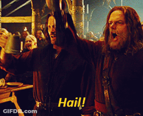 Two Men Are Raising Their Arms In The Air And One Of Them Is Saying " Hail " GIF