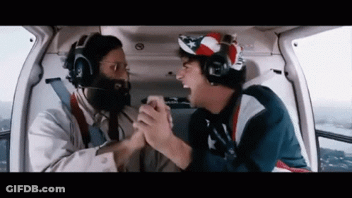 Two Men Shaking Hands In Helicopter GIF