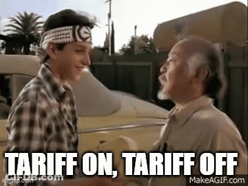 Two Men Are Shaking Hands In Front Of A Car With The Words `` Tariff On , Tariff Off '' Written Below Them . GIF