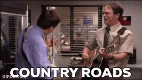 Two Men Are Singing And Playing Guitars With The Words Country Roads Written Below Them GIF