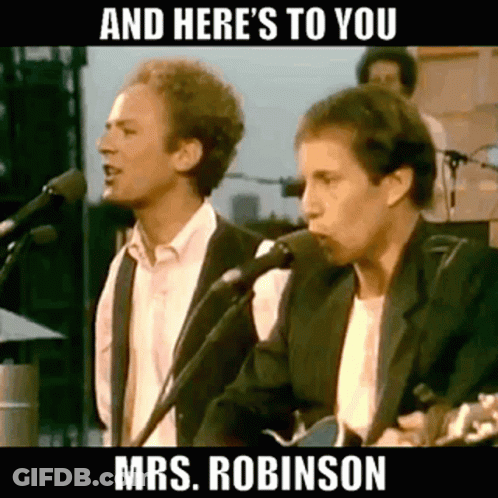 Two Men Are Singing Into Microphones While Playing Guitars On Stage . GIF