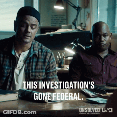 Two Men Are Sitting At A Desk With A Caption That Says This Investigation 'S Gone Federal GIF