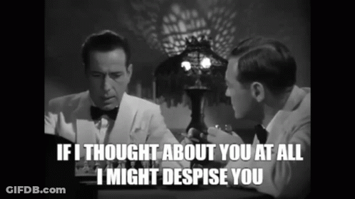 Two Men Are Sitting At A Table And One Of Them Is Saying If I Thought About You At All I Might Despise You GIF