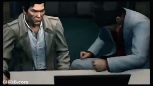 Two Men Are Sitting At A Table In A Video Game Talking To Each Other . GIF