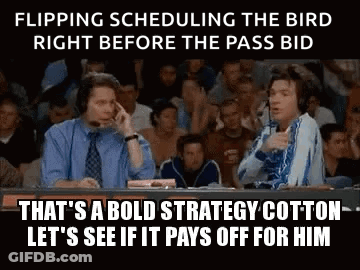 Two Men Are Sitting At A Table In Front Of A Crowd Talking On A Cell Phone . GIF