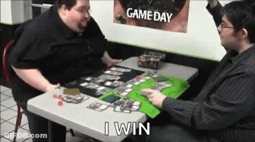Two Men Are Sitting At A Table Playing A Board Game And One Of Them Is Saying `` I Win '' . GIF