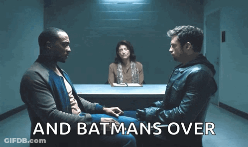 Two Men Are Sitting At A Table With A Woman Behind Them And The Words " And Batmans Over " Are Visible GIF
