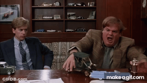 Two Men Are Sitting At A Table With Makeagif.com Written On The Bottom Right GIF