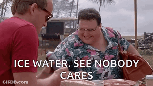 Two Men Are Sitting At A Table With The Words `` Ice Water , See Nobody Cares '' On The Screen . GIF