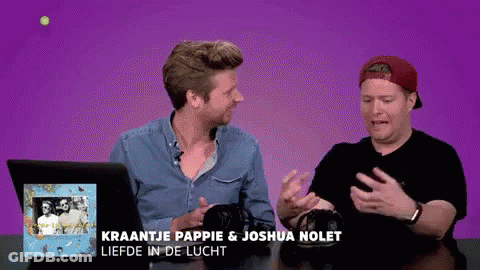 Two Men Are Sitting At A Table With The Words Kraantje Pappie & Joshua Nolet Liefde In De Lucht GIF