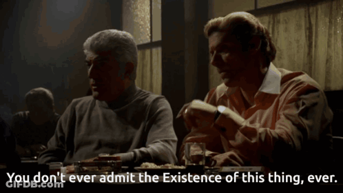 Two Men Are Sitting At A Table With The Words You Don T Ever Admit The Existence Of This Thing Ever GIF