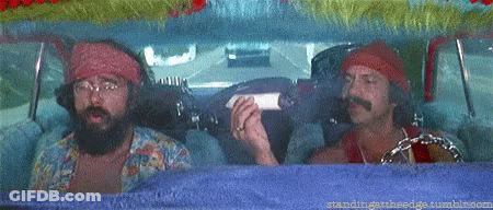 Two Men Are Sitting In A Car And One Has A Beard GIF