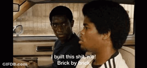 Two Men Are Sitting In A Car And One Of Them Is Saying `` I Built This Shit , Me ! Brick By Brick '' GIF
