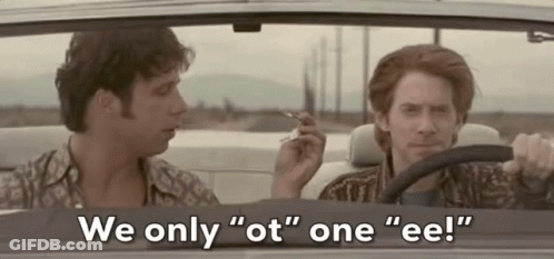 Two Men Are Sitting In A Car And One Of Them Is Smoking A Cigarette . GIF